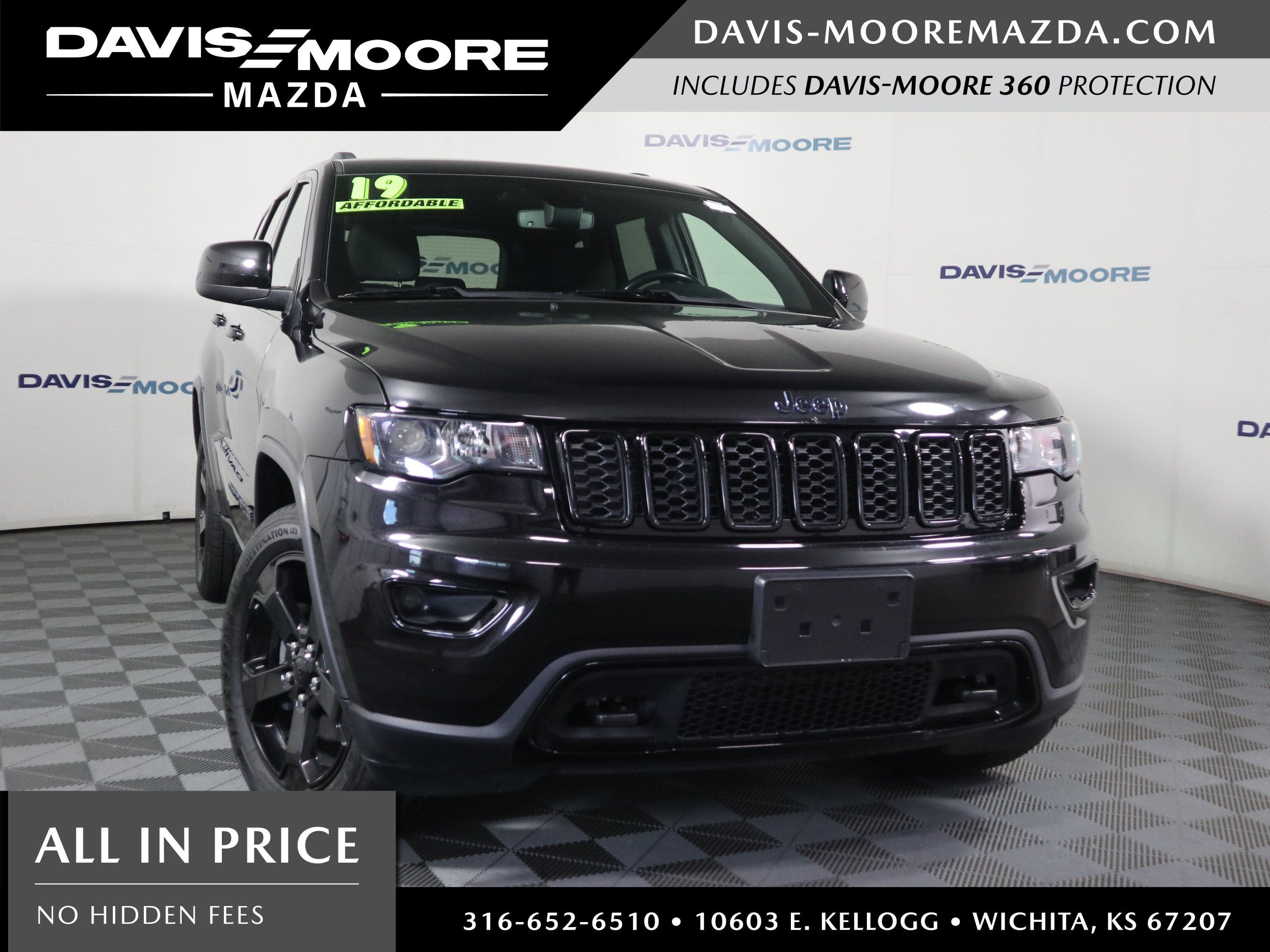 2019 Jeep Grand Cherokee Upland 4x4 in Black — front three-quarter view